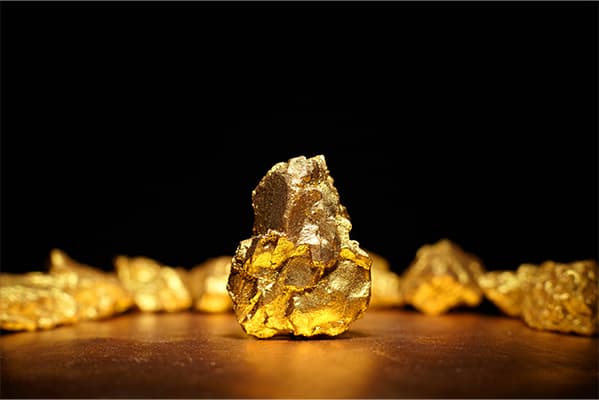 https://tower.topgoldinvestors.com/wp-content/uploads/2022/10/Closeup-of-big-gold-nugget-finance-concept.jpg